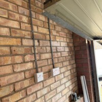 Installation of extra sockets and switches in a garage improving accessibility and functionality of the electrical system Extra sockets and switches in a garage